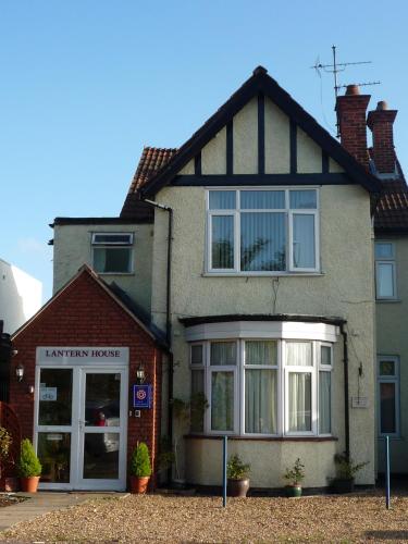 a house with a sign in front of it at Lantern House in Cambridge