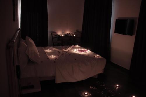 a bedroom with a bed with lights on it at Hotel A44 in Tetouan