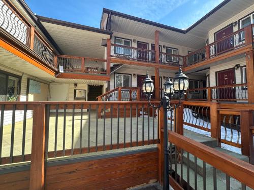 a balcony of a house with wooden railings at Matterhorn Inn Ouray in Ouray