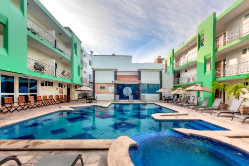 a swimming pool in the middle of a building at Quality Inn Mazatlan in Mazatlán