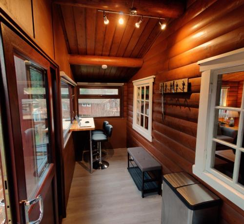 an interior of a tiny house with wood paneling at Serene Snowdonia Retreat in Trawsfynydd