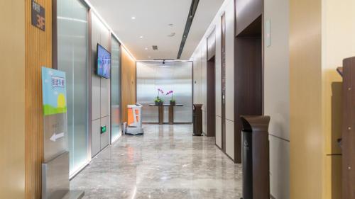 a hallway of an office with a table in the distance at Holiday Inn Express Xi'an North by IHG in Xi'an