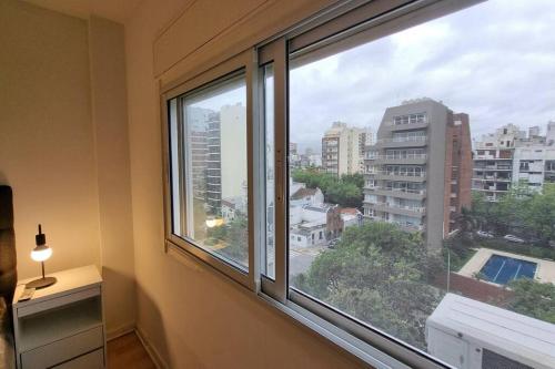 a room with a window with a view of a city at Hermoso departamento 4 personas in Buenos Aires
