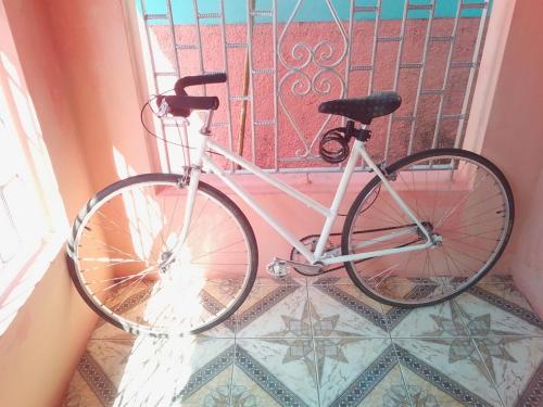 a bike parked in front of a window at Port Antonio Residence in Port Antonio