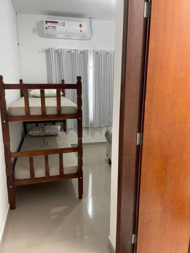 Postel nebo postele na pokoji v ubytování Casa com piscina ACONCHEGO no balneário de Shangri-lá