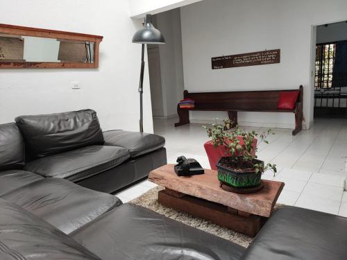 a living room with a couch and a table at La Villa The View in Pance