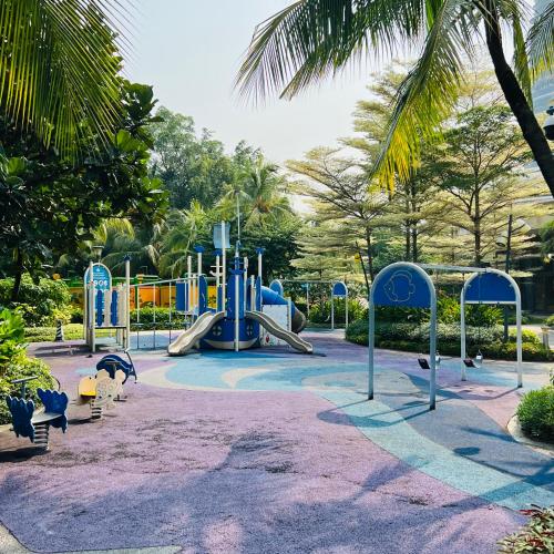 a playground with a slide in a park at Seaview 2B1R 6pax Condo Forest City 2E-2117 in Gelang Patah