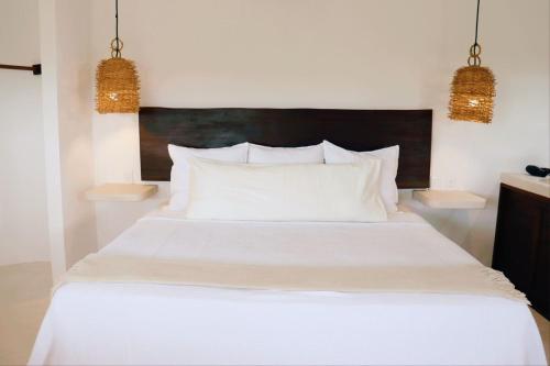 Cama o camas de una habitación en Mis Sueños Holbox
