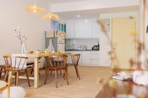 a kitchen with a table and chairs in a room at Lazy Cozy Summer Afternoon Healing Daily Life in Klang