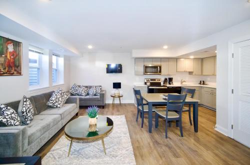 a living room with a couch and a table at The Lenny: Modern Boutique Loft in Washington, D.C.