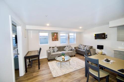 a living room with a couch and a table at The Lenny: Modern Boutique Loft in Washington, D.C.