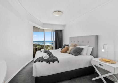 Ένα ή περισσότερα κρεβάτια σε δωμάτιο στο Sensational Ocean View 2 Bedroom Apartment