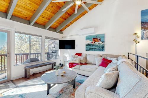 a living room with a couch and a table at Making Waves, Unit B in Stateline