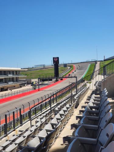a row of empty seats in a racing track at Green Haven Studio near Austin Airport COTA in Austin