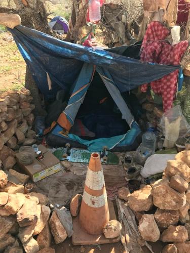 a tent sitting on top of a pile of rocks at Pedro's camp in Agadir