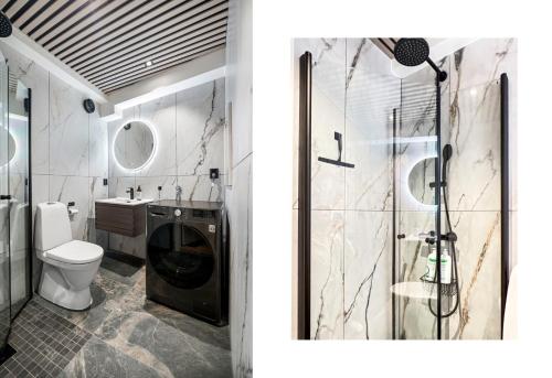 La salle de bains est pourvue d'une douche et de toilettes. dans l'établissement King bed - Behind Bryggen - Renovated des 23, à Bergen
