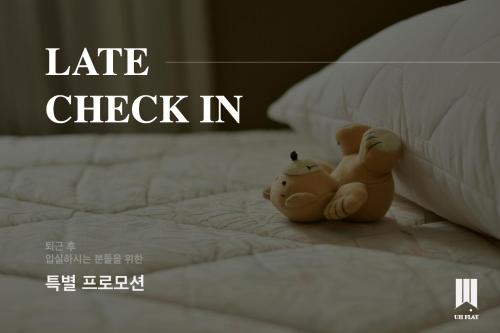 Postel nebo postele na pokoji v ubytování UH FLAT The SEOCHO