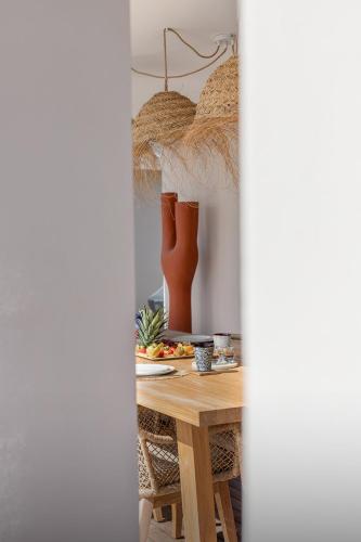 a table with a plate of food on it at 3-bedrooms Villa 5min from Orient Bay in Cul de Sac