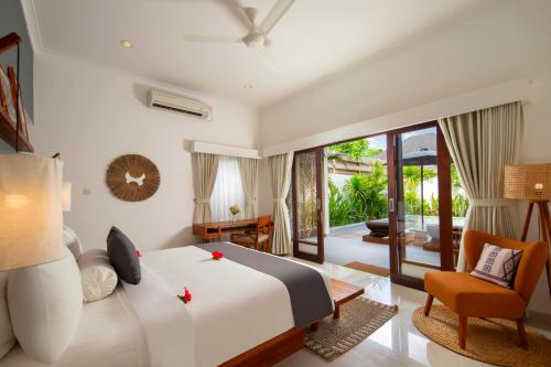 Ένα ή περισσότερα κρεβάτια σε δωμάτιο στο Utara Villas