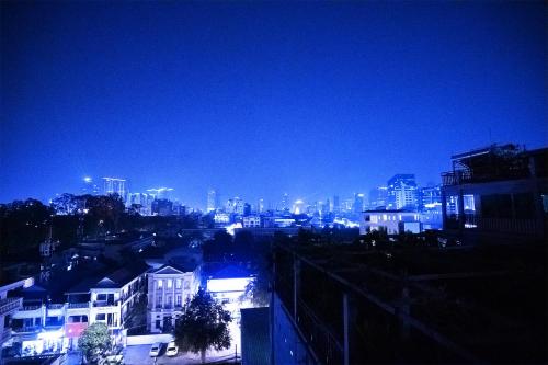 a view of a city at night with lights at Daun Penh Palace Boutique in Phnom Penh