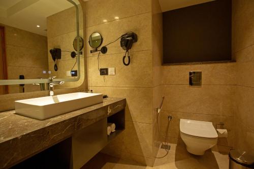 a bathroom with a sink and a toilet at ARISTA BY AMBITION in Guwahati