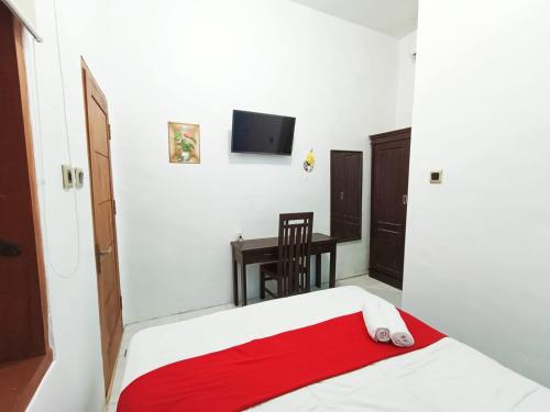 Кровать или кровати в номере YUTAKA INN Banyuwangi Syariah