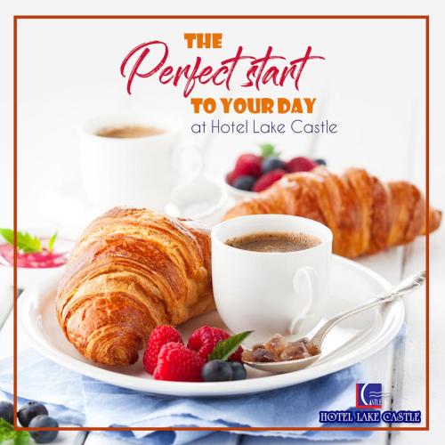 a plate of croissants and a cup of coffee and berries at HOTEL LAKE CASTLE - Parkview in Dhaka