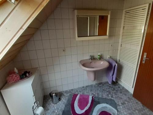 a small bathroom with a sink and a sink at Holiday apartment Renate in Rottenburg