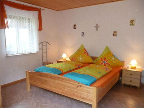 En eller flere senger på et rom på Holiday apartment Ferienhof Benz