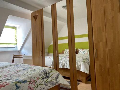 a bedroom with two bunk beds and a window at Apartment Philipps 2 in Graach