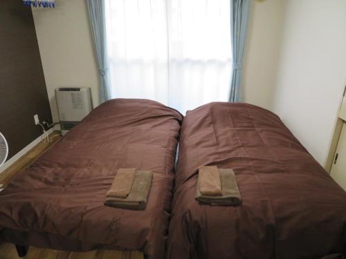 Postel nebo postele na pokoji v ubytování 札幌市中心部大通公園まで徒歩八分観光移動に便利なロケーションp3112