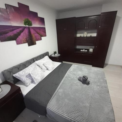 Un pat sau paturi într-o cameră la Apartman Diva
