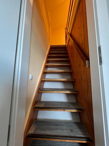 a staircase leading up to a door in a building at Hotel Tum Stüürmann in Büsum