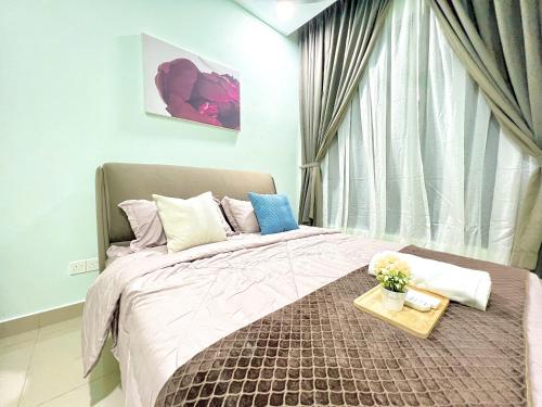 a bedroom with a large bed with a tray on it at D'Chill Suite【Austin Regency】Netflix in Johor Bahru
