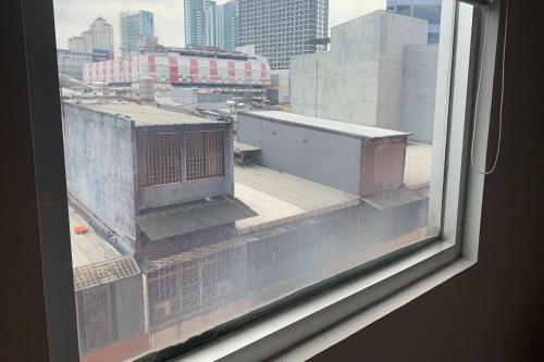 a view of a city from a window at Hotel Glodok Plaza in Jakarta