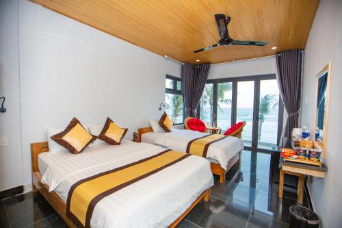 Katil atau katil-katil dalam bilik di Palm Beach Hotel Phu Yen - Kite surfing spot in winter