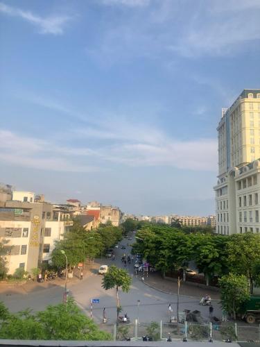 a street in a city with buildings and trees at Homestay HaNoi Amazing in Hanoi