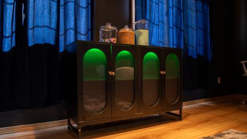a cabinet with green lights on top of it at Hot tub, Pool Table, Rv Parking! in Mount Hood Village
