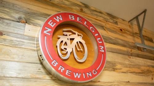 a sign on a wall that reads new beer brewing at Hot tub, Pool Table, Rv Parking! in Mount Hood Village