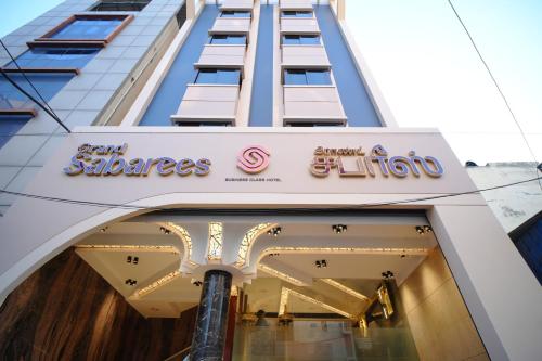 a store front of a building with a sign on it at Hotel Grand Sabarees in Madurai