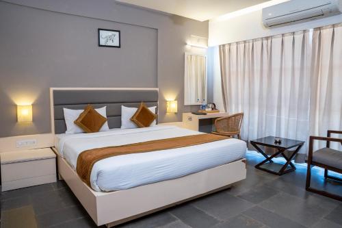 Postel nebo postele na pokoji v ubytování Hotel Dwarawata