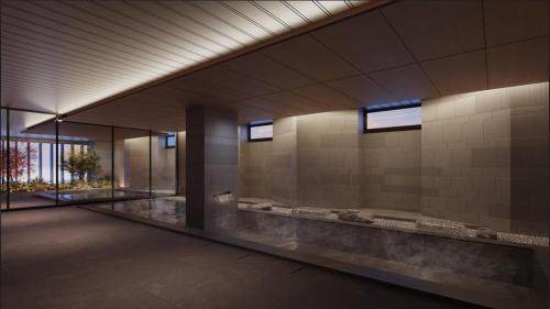 a lobby of a building with a large bathroom at Nikko Style Niseko HANAZONO in Kutchan