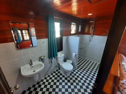 a bathroom with a toilet and a sink at Lucky Bungalow in Khao Lak
