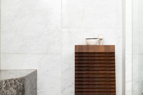 a bathroom with a counter with a vase on it at Renaissance Xi'an Hotel in Xi'an