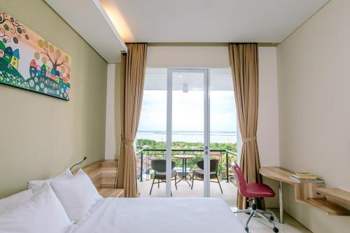 Postel nebo postele na pokoji v ubytování Mahogany Hotel