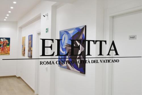 a view of a gallery with paintings on the wall at Eletta Guest House in Rome