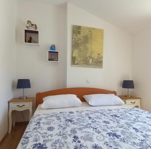 Llit o llits en una habitació de Apartments Donda