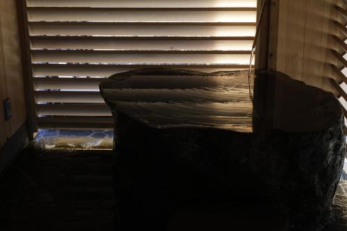 a room with a window with blinds on it at Satoyama Jujo The House in Minami Uonuma