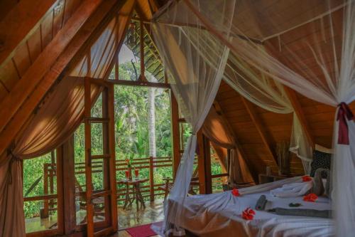 Katil atau katil-katil dalam bilik di Cinnamon Paradise