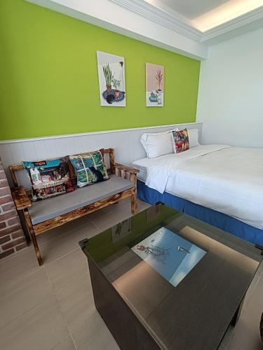 Una cama o camas en una habitación de 迦那會館